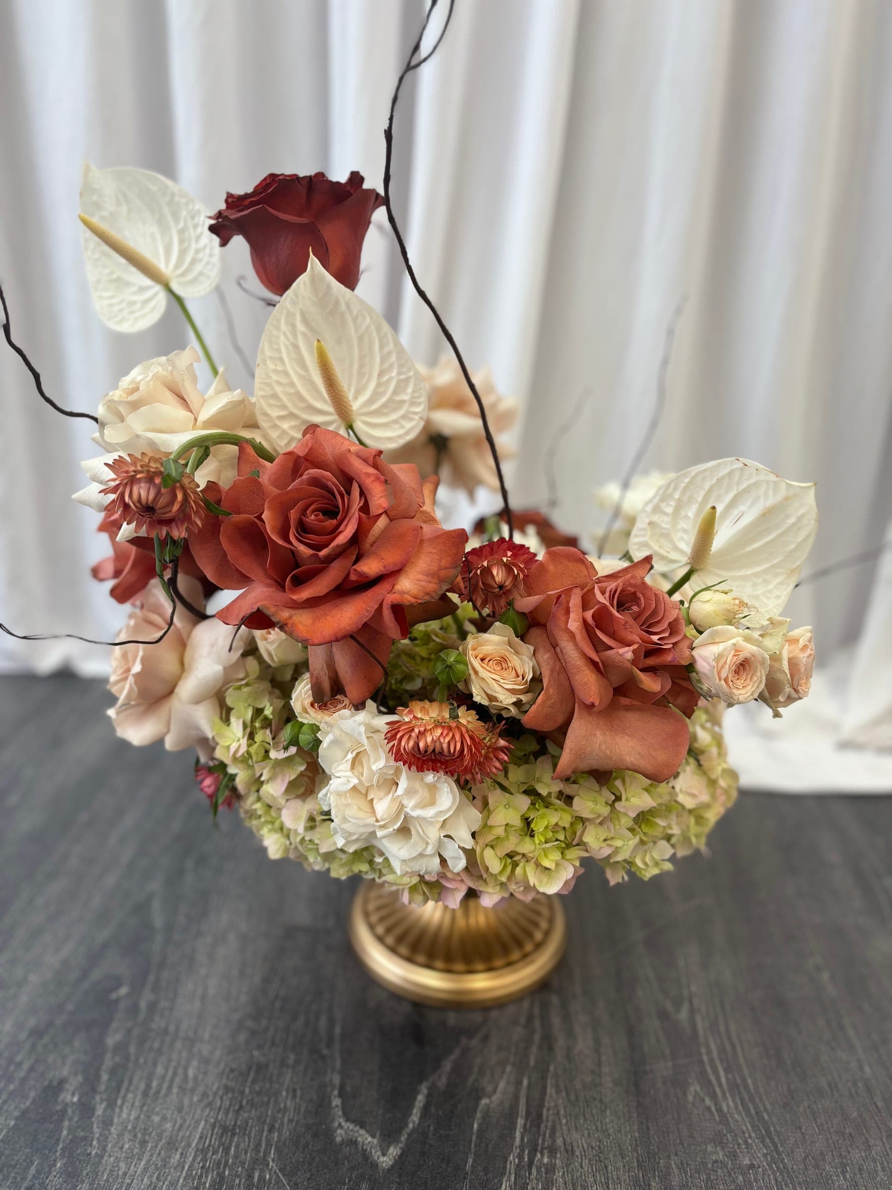 Signature floral installation: rose, hydrangea & anthurium centerpiece
