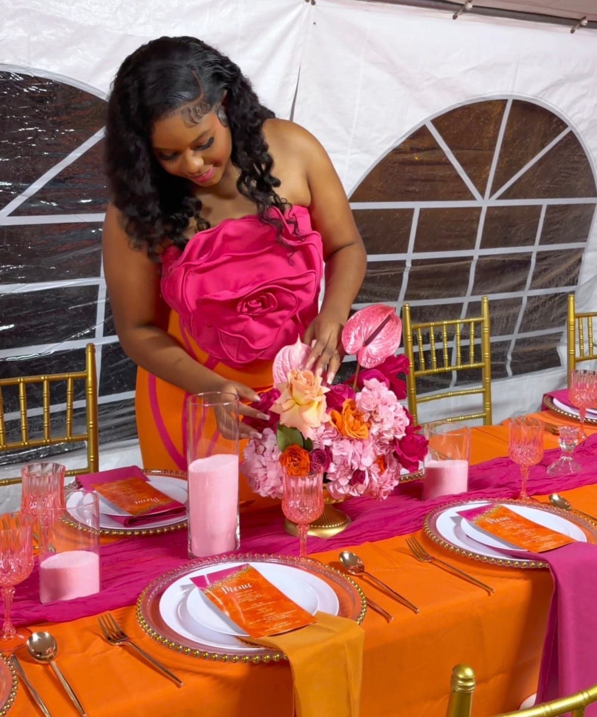 Redgine arranging a floral centerpiece